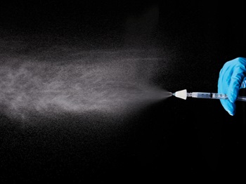 DART Nasal Atomizer with Syringe attached in use showing mist pattern